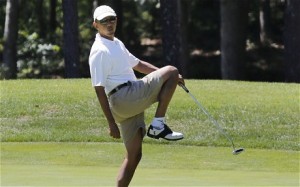 MUFFED IT: Obama misses a putt during a golf game, just as he muffed the chance to sort out Syria