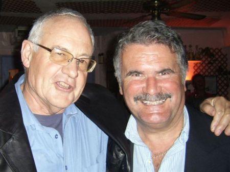 SMILING SCAMSTERS: Richard Pollett (left) with John Hirst in the good times, when their con was scooping millions