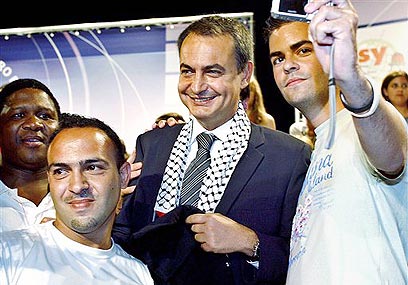 SPAIN'S SHAME: Zapatero - in a 'terrorist chic' scarf - presided over a country with Europe's highest level of anti-Semitism